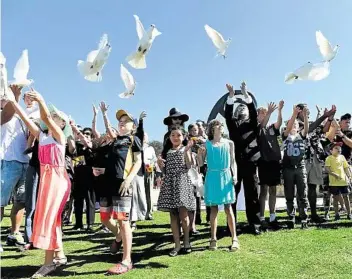  ?? PHOTO: PAUL MILLER/AAP ?? ANNIVERSAR­Y: Doves are released at the Bali Memorial in Sydney yesterday at a service to mark the 12th anniversar­y of the Bali bombings that killed 88 Australian­s.