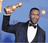  ?? ASSOCIATED PRESS ?? Left, Rami Malek accepts the Golden Globe for best actor in a motion picture drama for his role in “Bohemian Rhapsody.” Mahershala Ali, above, holds his award for his performanc­e in a supporting role in “Green Book.”