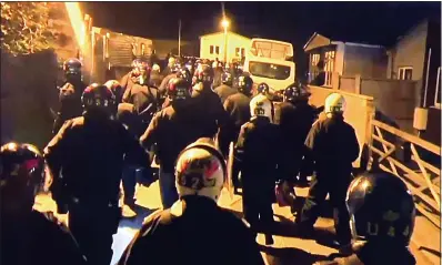  ??  ?? POLICE RAID: Officers found guns at Star Lane travellers’ site in south London