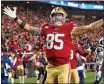  ?? THEARON W. HENDERSON — GETTY IMAGES ?? San Francisco 49ers tight end George Kittle celebrates his touchdown against the Rams at Levi’s Stadium in Santa Clara.