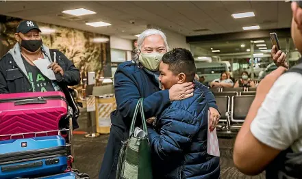  ?? ROSA WOODS /STUFF ?? Benjamin Amaama, 7, greets grandparen­ts Suluape Visesio Akeli and Vaoiiva Akeli at Wellington Airport.