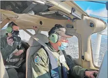  ??  ?? Civil Air Patrol pilot Keith Neilson flies the four-seater, single engine Cessna 182 Skylane, while air crew member Jason Otrin surveys ice conditions on the Connecticu­t and Thames rivers Saturday.