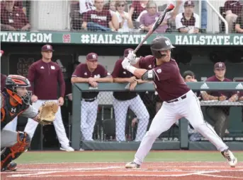  ?? Jason Cleveland, SDN) (Photo by ?? Ryan Gridley, right, hits for Mississipp­i State during Friday's game against the Auburn Tigers.