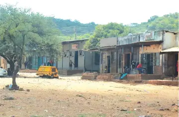  ?? ?? Theleka shops where the violence by amakorokoz­a allegedly started in Filabusi, Insiza District.