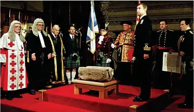  ??  ?? Handover ceremony: Prince Andrew with the Stone of Scone at Edinburgh Castle in 1996