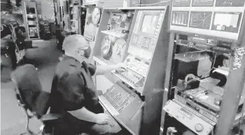  ?? STEPHEN BATTAGLIO/LOS ANGELES TIMES ?? Kurt Spada, lead encode operator at Iron Mountain Entertainm­ent Services, digitizes a two-inch video reel. Early in his career, he was a TV technician.