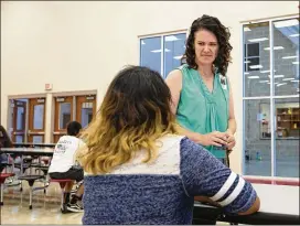  ?? LYNDA M. GONZALEZ / AMERICAN-STATESMAN ?? School counselor Deanna Baker visits with summer school students at Vista Ridge High School in Cedar Parklast week. Gov. Greg Abbott called on districts to add counselors, but budget deficits may make that impossible.