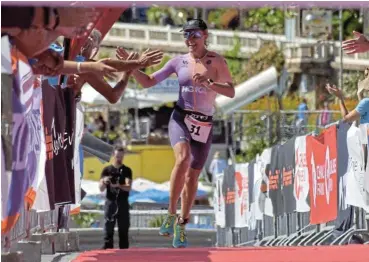  ?? /Alberto Fumi ?? Leading the way: Magda Nieuwoudt crosses the line to win the Challenge Sanremo, one of four triathlons she won in the recent Challenge Family triathlon series held around Europe.