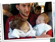  ??  ?? HORROR:
A father clutches two babies killed in the sarin attack at Khan Sheikhoun earlier this month