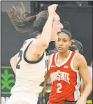  ?? Cliff Jette The Associated Press ?? Iowa guard Caitlin Clark celebrates after sinking a foul shot against Ohio State to become the all-time leading scorer in NCAA D-I basketball.