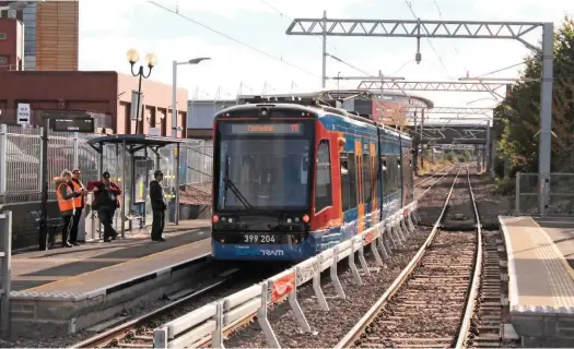  ?? MIKE HADDON. ?? A trailing view of 399204, departing Rotherham Central tram Platform 3 for Sheffield Cathedral at 1502 on October 25. It did not reach its intended destinatio­n after a collision with a lorry at a crossing in the Attercliff­e area. The front end of the unit was derailed and damaged.