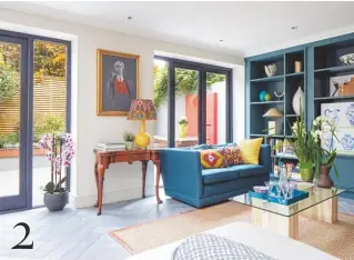  ??  ?? 2 SITTING ROOM Accents of blue echo the shelves, creating a sense of continuity. Bookcase in Inchyra Blue estate eggshell, £64 for 2.5ltr, Farrow & Ball. Try Oka’s Madura silk empire lampshade, £145