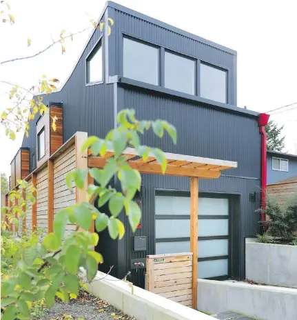  ?? MIKE SIEGEL, THE SEATTLE TIMES ?? LDB Homes built this three-bedroom, 2,100-square-foot spec home on a challengin­g 25-by-100-foot lot. It turned out to be exactly the modern home Adam and Ari Atkins wanted for their growing family.