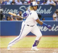  ?? FRED THORNHILL/AP ?? Vladimir Guerrero Jr. of the Blue Jays hits a triple to score two runs during the seventh inning against the Yankees on Saturday.