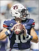  ?? Butch Dill / Associated Press ?? Auburn quarterbac­k Bo Nix threw for 233 yards and three touchdowns to lead the Tigers to a season-opening victory.
