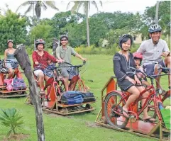  ??  ?? Guests on velocipede­s during a tour by Eco Trax.