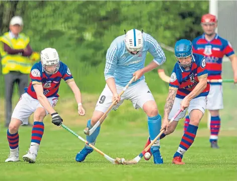  ?? Picture by Neil G Paterson ?? HUSTLED: Caber’s Liam Symonds loses out to Ruaridh Anderson and James Falconer.