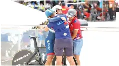  ??  ?? Pang embraces Waldron after the latter gave everything he had to clinch a historic bronze medal in track cycling at the Velodrome Rakyat in Ipoh, yesterday.