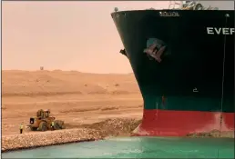  ?? SUEZ CANAL HEAD OFFICE/XINHUA/ZUMA PRESS ?? An Evergreen cargo container ship was trapped on the Suez Canal of Egypt on Wednesday. Egypt's Suez Canal Authority said Wednesday it had diverted ships to its old channel after a giant cargo container ship blocked the course of the new crossing.