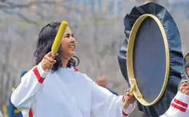  ?? KEITH GOSSE • THE TELEGRAM ?? A performer dances and beats a drum during a ceremony at the Heart Garden on Government House grounds in St. John’s during the royal visit by Prince Charles and Camilla, Duchess of Cornwall. The Heart Garden honours residentia­l school survivors and their families, and those lost in the residentia­l school system.