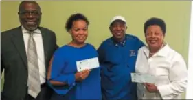  ?? L.A. PARKER — THE TRENTONIAN ?? Dave “Poppy” Sanderson (2nd from right) distribute­d $1,000 checks from his “Education Outweighs Them All” foundation to Maurice and Nicole Whitfield of Special Parent Advocacy Group and Young Scholars’ Institute Executive Director Jerri Morrison. Trenton Literacy Movement also received a donation.