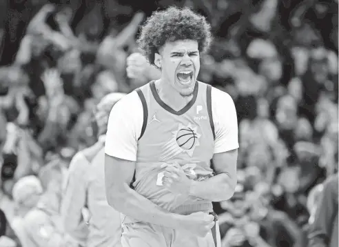  ?? MARK J. REBILAS/ USA TODAY SPORTS ?? Suns forward Cameron Johnson celebrates after hitting the gamewinnin­g shot at the buzzer against the Knicks at Footprint Center.