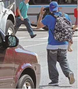  ?? STAFF PHOTOS BY STUART CAHILL ?? WALK THIS WAY: Boston pedestrian­s often walk with impunity knowing that if they are caught jaywalking they at most face a measly $1 ticket.