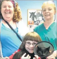  ??  ?? n RELIEF: Caroline and Summer Shervill with vet Dr Hazel Lee and a recovering Milo; (right) the needle and thread