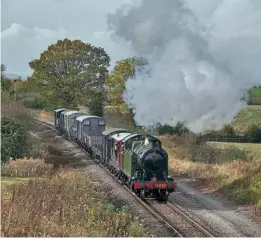  ?? ?? Left: GWR 2-8-0T No. 4270 heads from Gotheringt­on towards Toddington on October 30 with the goods train. Photograph­er Paul Stratford worked for more than 10 years on the locomotive’s original restoratio­n and captured it on camera on its first gala appearance on May 24, 2014. He travelled from mid-Wales specially to see its final gala appearance on the line. PAUL STRATFORD