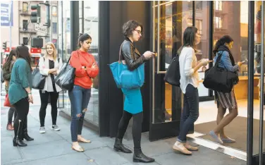  ?? Laura Morton / New York Times ?? Women line up for an event to attract women to the cryptocurr­ency industry in San Francisco.