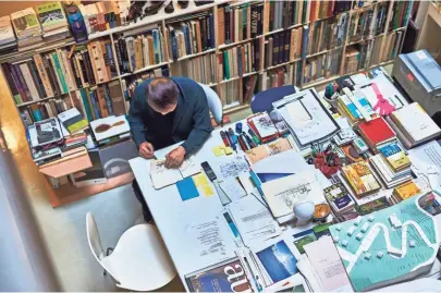  ?? PAUL BARBERA VIA AP ?? Tadao Ando works at his desk in Osaka, Japan. The photo is featured in “Where They Create,” a book exploring people and their creative studios.