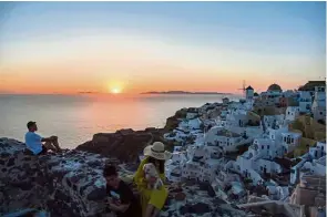  ??  ?? The town of Oia in the Greek island of Santorini is already seeing a healthy stream of local tourists visiting the place. — AFP