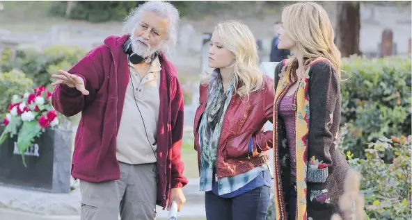  ?? — SEPIA FILMS ?? Director Vic Sarin talks to actors Emily Osment, centre, and Victoria Pratt on the set of A Daughter’s Nightmare, one of the many movies shot in the Okanagan in recent years, as studios take advantage of the California-like scenery and lower costs.