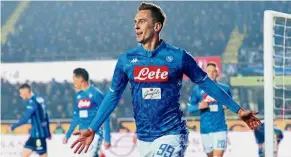  ??  ?? The saviour:Napoli’s Arkadiusz Milik celebratin­g after scoring their third goal in the Serie A match against Atalanta in Bergamo on Monday. — Reuters