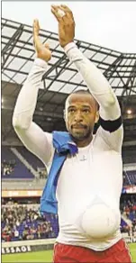  ?? Photo by Getty ?? Thierry Henry acknowledg­es fans following his first MLS hat trick Saturday in victory over Montreal at Red Bull Arena.