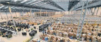  ??  ?? The Amazon fulfilment centre in Peterborou­gh, which is recuiting for more than 2,000 seasonal staff.