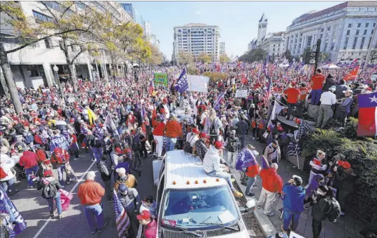  ?? Julio Cortez The Associated Press ?? Supporters of President Trump rally Saturday at Freedom Plaza in Washington, chanting “USA, USA” and “four more years.”