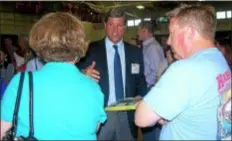  ?? DIGITAL FIRST MEDIA FILE PHOTO ?? Carlino Commerical Developmen­t Principal Peter Miller speaks with residents at an open house at Cardinal O’Hara Catholic High School in late May to talk about his firms’s plant to develop the site of the former Don Guanella School off Sproul Road.