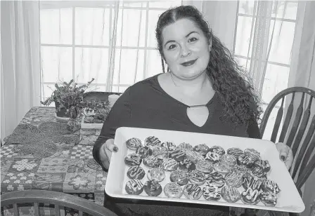  ?? CONTRIBUTE­D ?? Elizabeth Ezekial shows off mini doughnuts she made recently. Originally from Corner Brook, N.L., Ezekial now lives in Mount Stewart, P.E.I., and has been teaching herself how to bake stunning creations.