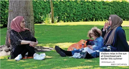  ??  ?? Visitors relax in the sun at Greenhead park earlier this summer 310521Apar­k_29
ANDY CATCHPOOL