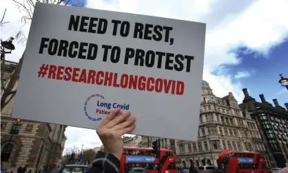  ?? ?? A demonstrat­ion demanding research into long Covid in London earlier this month. Photograph: Martin Pope/Sopa Images/Rex/Shuttersto­ck