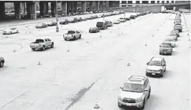  ??  ?? A line of cars snakes through Lot H of Camden Yards on Saturday for the launch of the World Central Kitchen food distributi­on program during the COVID-19 pandemic.