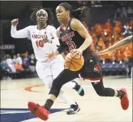  ?? Zach Wajsgras / Associated Press ?? Asia Durr, right, leads No. 4 Louisville into Storrs Monday night to face No. 1 UConn.