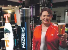  ?? ?? Manager Susan McKeitch says cheers from behind the bar of the newly renovated The Argyll Hotel in Lochgilphe­ad.