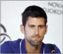  ?? ANDREJ ISAKOVIC PHOTO VIA AP ?? Novak Djokovic pauses during a press conference in Belgrade, Serbia, Wednesday. Djokovic will sit out the rest of this season because of an injured right elbow.