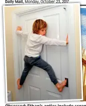  ??  ?? Obsessed: Ethan’s antics include scrambling on to the garden shed and, photograph­ed by his parents, using the handles to climb doors and scaling his wardrobe