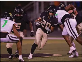  ?? (Arkansas Democrat-Gazette/Colin Murphey) ?? Nick Abrams (middle) of Joe T. Robinson looks for running room Friday during the Senators’ 30-21 loss to the Mills Comets.