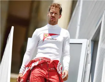  ?? — AFP photo ?? File photo shows Vettel walks during a practice session.