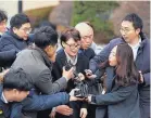  ?? LEE JIN-MAN/ASSOCIATED PRESS ?? Yoon Jeon-chu, center, who has been President Park Geun-hye’s aide since 2013, is questioned by media on her arrival Thursday for Park’s impeachmen­t hearing.