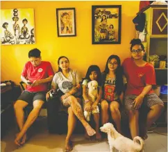  ??  ?? Bong Florentino, left, and Yllang Montenegro share their home in Quezon City, Philippine­s, with niece Tata and children Anda and Jun. The couple were stranded in
Japan for three months due to COVID-19.